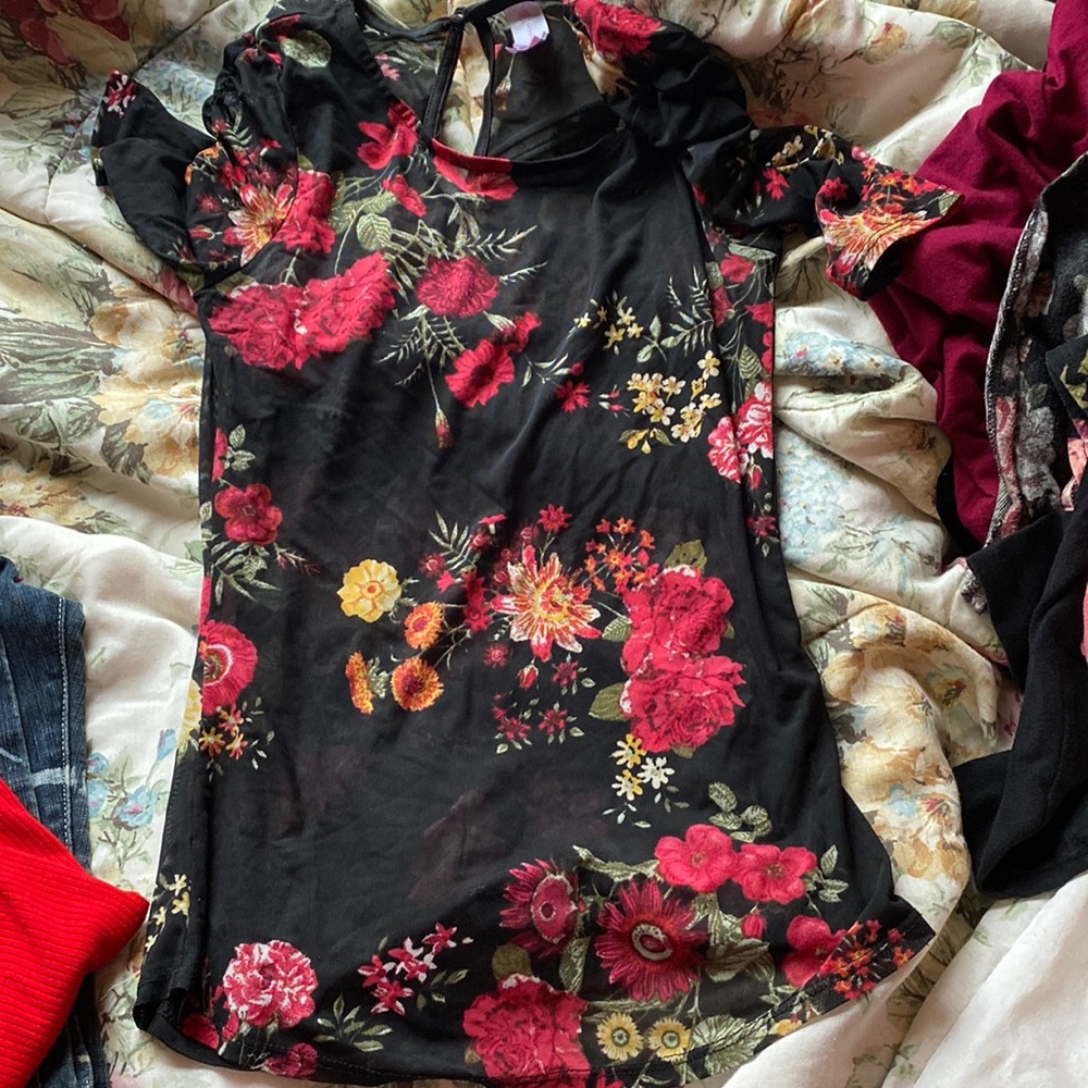 A see through flower top; haven’t worn it in a while and doesn’t really fit well
